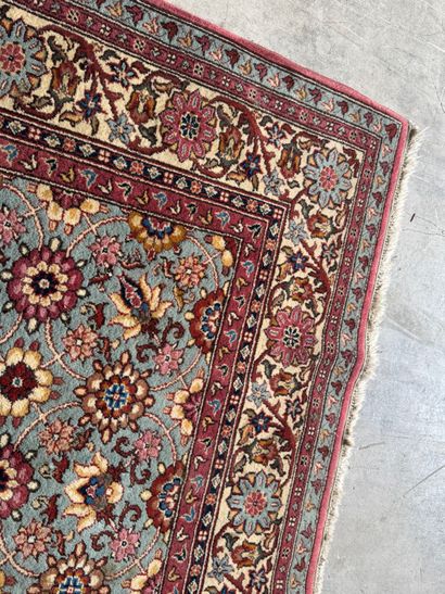 Polychrome wool carpet with floral motifs....