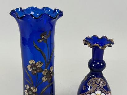 Two colored glass vases, one enameled with...