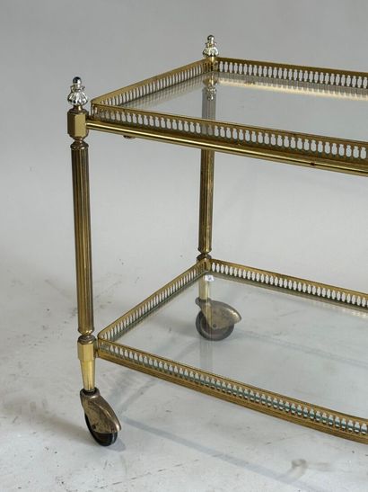 Small gilded metal and glass-topped rolling...