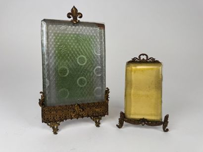 Two beveled glass and openwork brass photo...