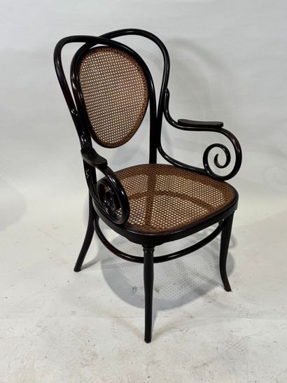 KOHN Stained bentwood armchair, cane seat....