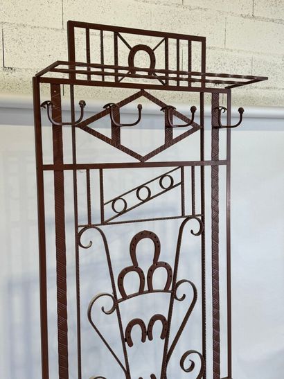 Wrought and painted iron checkroom decorated...