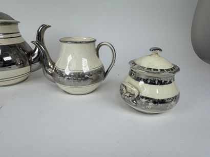LANGEAIS.
Four cream and silvered earthenware...
