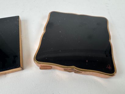 Three powder cases in gilded and lacquered...