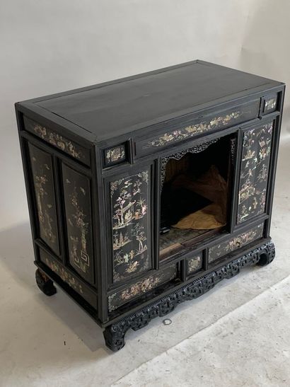 ASIA, 20th C. Low cabinet opening with two...