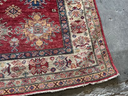 KAZAK. 
Polychrome wool carpet, the central...