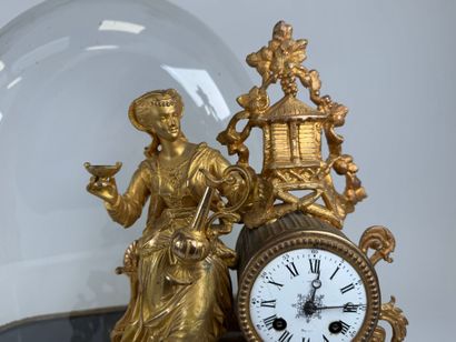 Gilded regule and alabaster clock decorated...