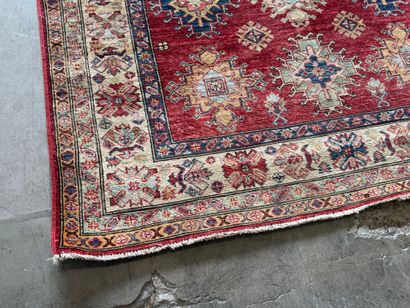 KAZAK. 
Polychrome wool carpet, the central...