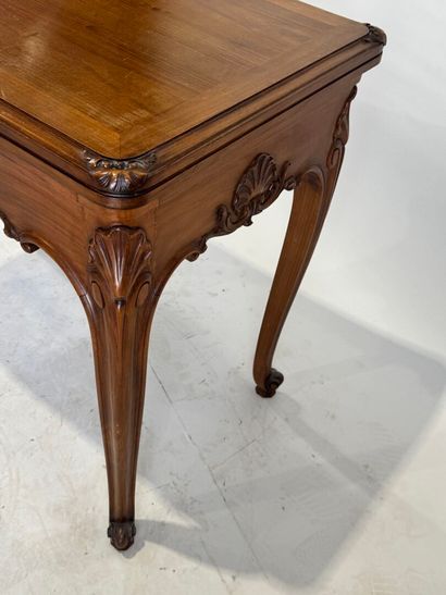 Molded and carved wood game table opening...