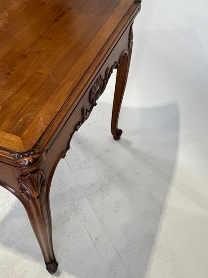 Molded and carved wood game table opening...