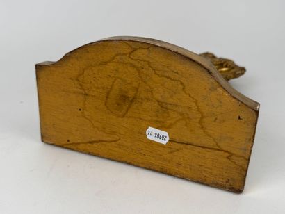 Carved and gilded wood and stucco watch-holder...