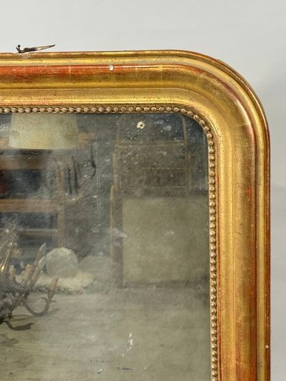 Wood and gilded stucco mirror decorated with...