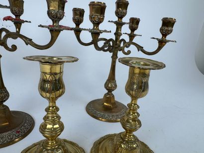 Two pairs of brass torches or candlesticks,...