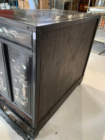 ASIA, 20th C. Low cabinet opening with two...