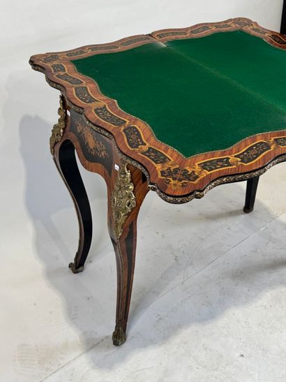 Wood and marquetry game table featuring a...