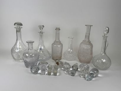 Seven glass and crystal decanters.
H. 30...