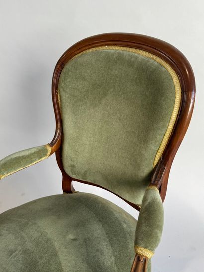 Moulded mahogany armchair with green velvet...
