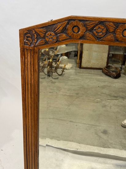 Molded and carved wood mirror with a frieze...