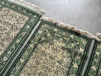 IRAN. 
Suite of three polychrome wool carpets...