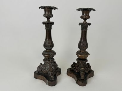 Pair of tripod candlesticks in patinated...