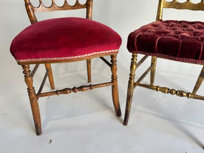 Two charivari chairs in molded and gilded...