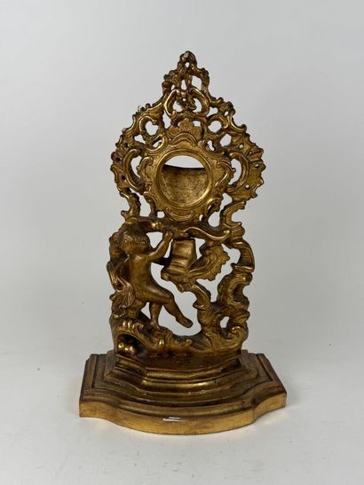 Carved and gilded wood and stucco watch-holder...