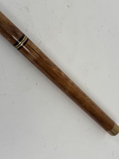 Wooden and brass system cane, the pommel...