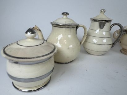 LANGEAIS.
Six cream and silver earthenware...