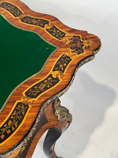 Wood and marquetry game table featuring a...