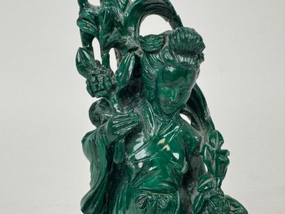 CHINA, 20th century.
Woman with flowers.
Carved...