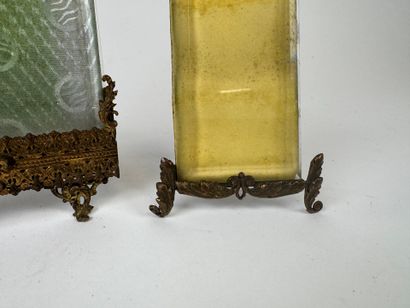 Two beveled glass and openwork brass photo...