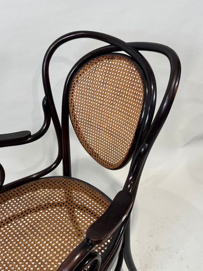 KOHN Stained bentwood armchair, cane seat....