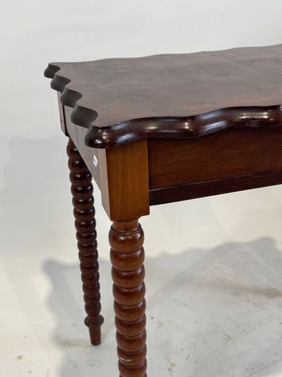 Small stained wood table or desk opening...