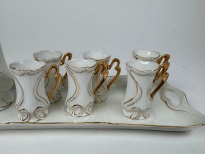 Small white and gold porcelain liqueur service...