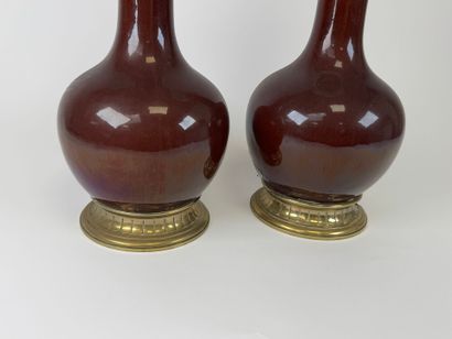 Pair of glazed ceramic kerosene lamps on...