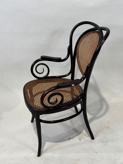 KOHN Stained bentwood armchair, cane seat....
