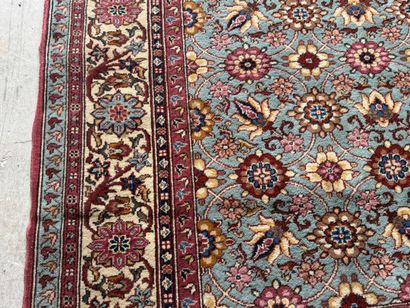Polychrome wool carpet with floral motifs....