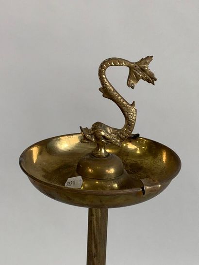 Brass ashtray decorated with stylized dolphins.
H....