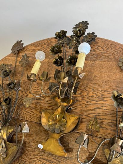 Suite of three four-light gilded metal sconces...