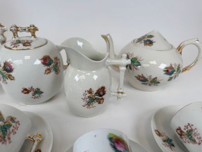 Part of a polychrome and gold porcelain coffee...