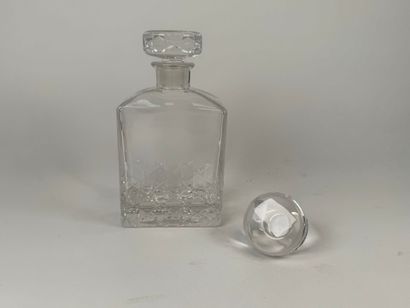 Cut crystal decanter. H. 20.5 cm. An identical...