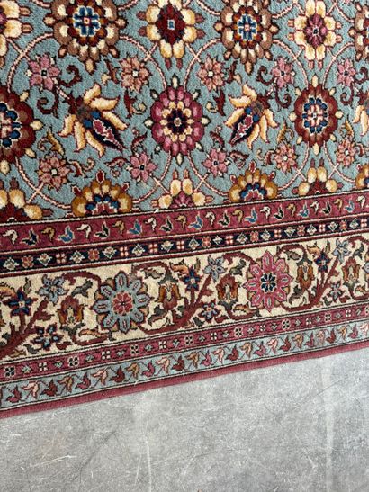 Polychrome wool carpet with floral motifs....
