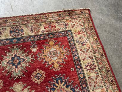 KAZAK. 
Polychrome wool carpet, the central...