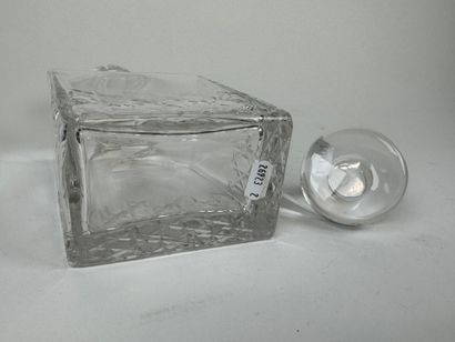 Cut crystal decanter. H. 20.5 cm. An identical...