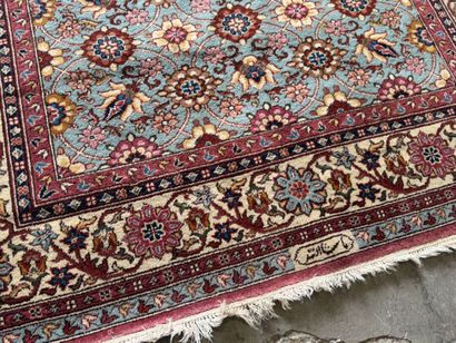 Polychrome wool carpet with floral motifs....