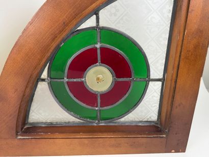 Two rounded triangular stained glass windows,...