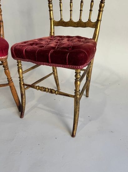 Two charivari chairs in molded and gilded...