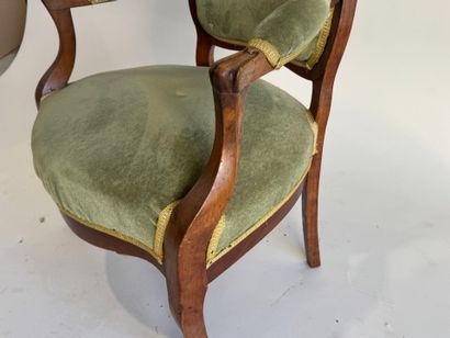 Moulded mahogany armchair with green velvet...