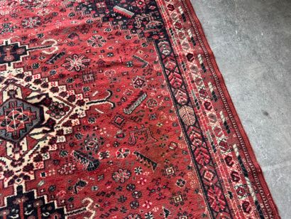 Polychrome wool carpet with stylized motifs...