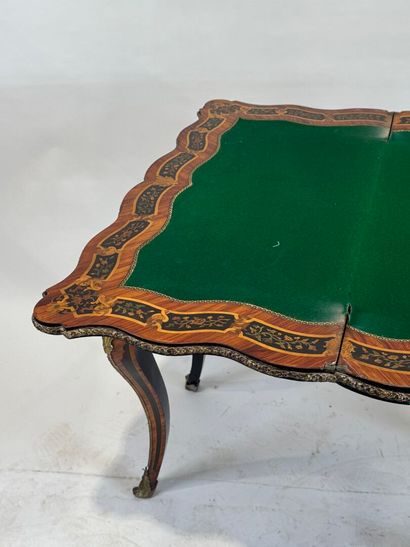 Wood and marquetry game table featuring a...